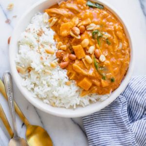 g nut sauce with rice and a side