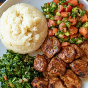 nyama choma, ugali, and greens